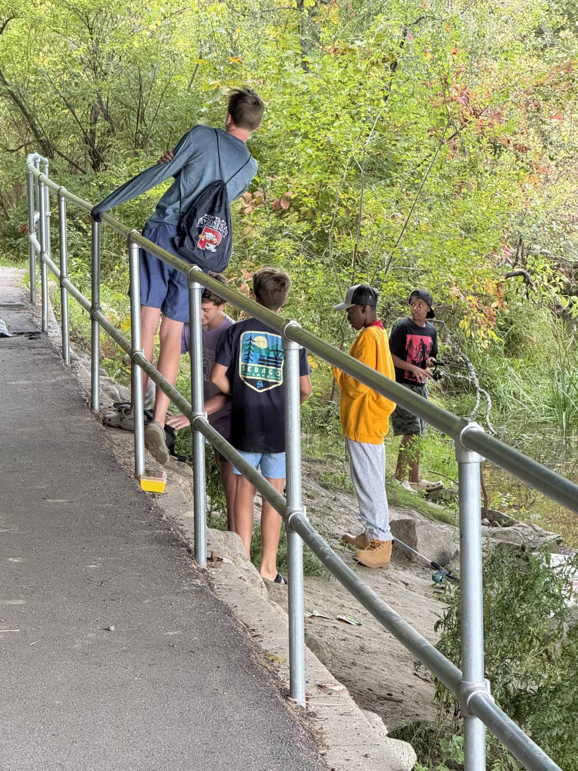 Boys fishing at Royal River Park in Yarmouth, Maine.